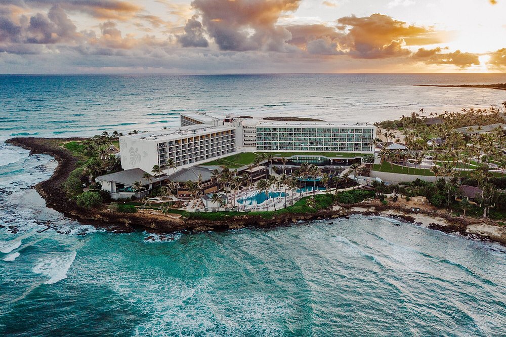 Aerial view of Turtle Bay Resort surrounded by coastline on 3 sides.